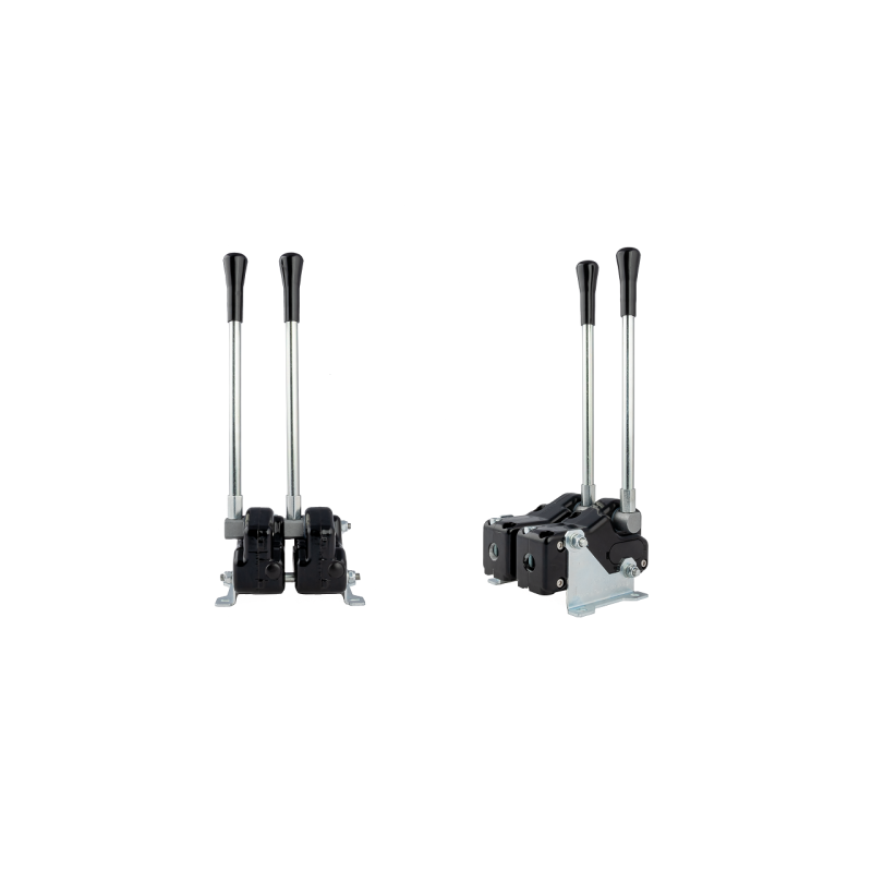 Dvi svirtys, valdančios hidraulinį skirstytuvą, papildomai korpusas su tvirtinimu prie pagrindo